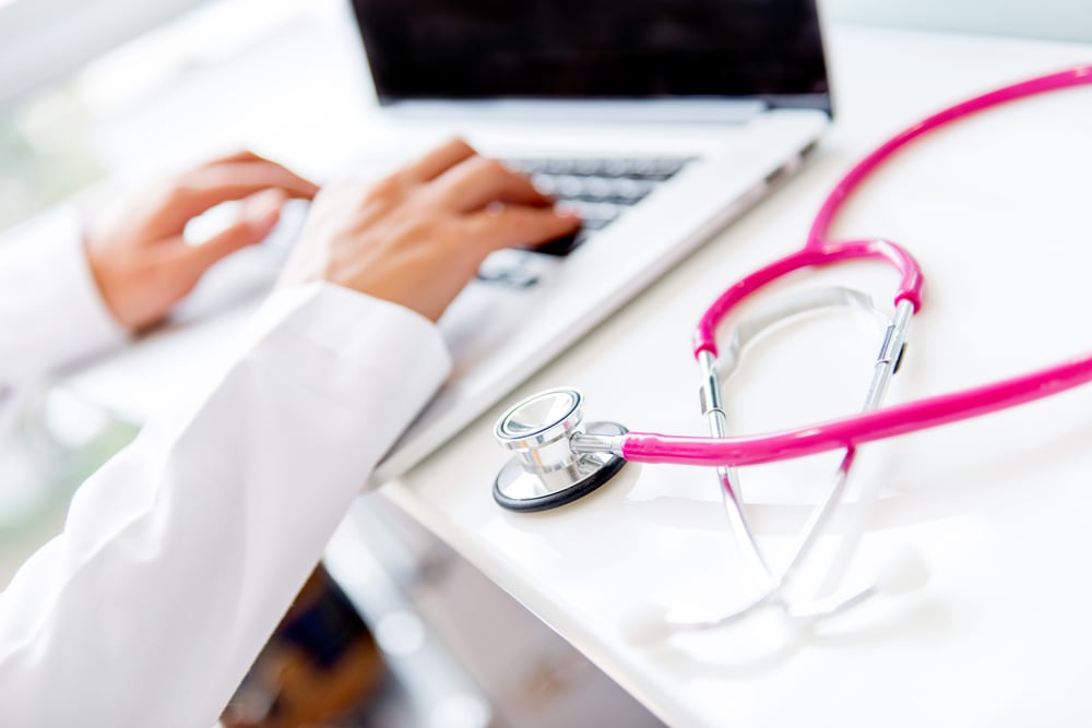 Healthcare worker typing